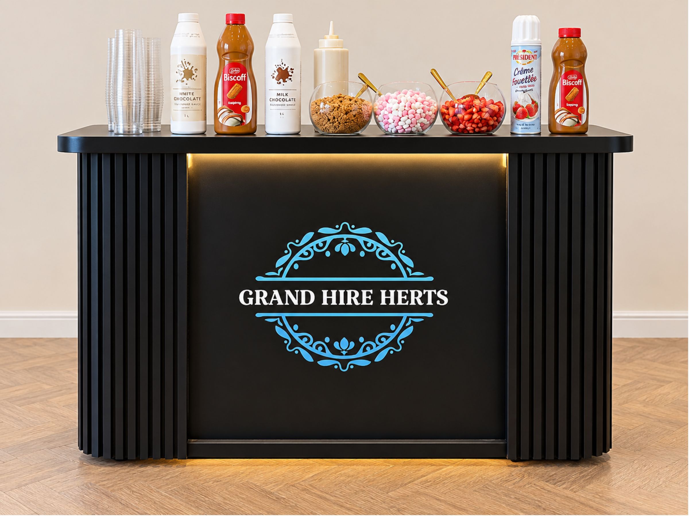 Black Grand Hire Herts pancake cart arranged with sauces, fruit and toppings.
