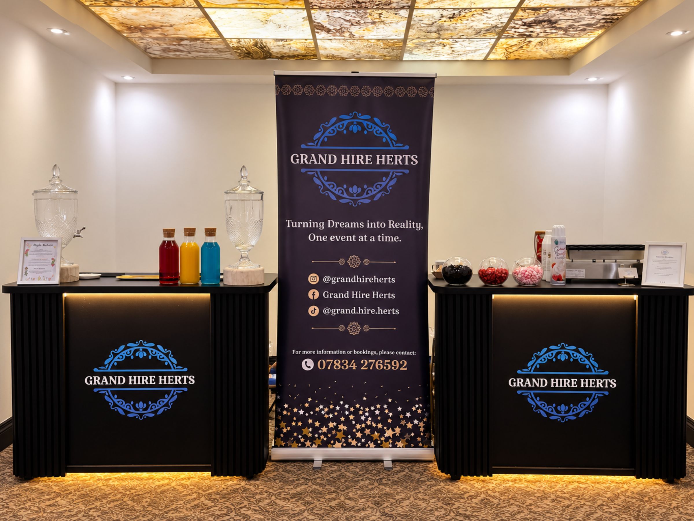Grand Hire Herts serving stations arranged with drinks and branded counters.